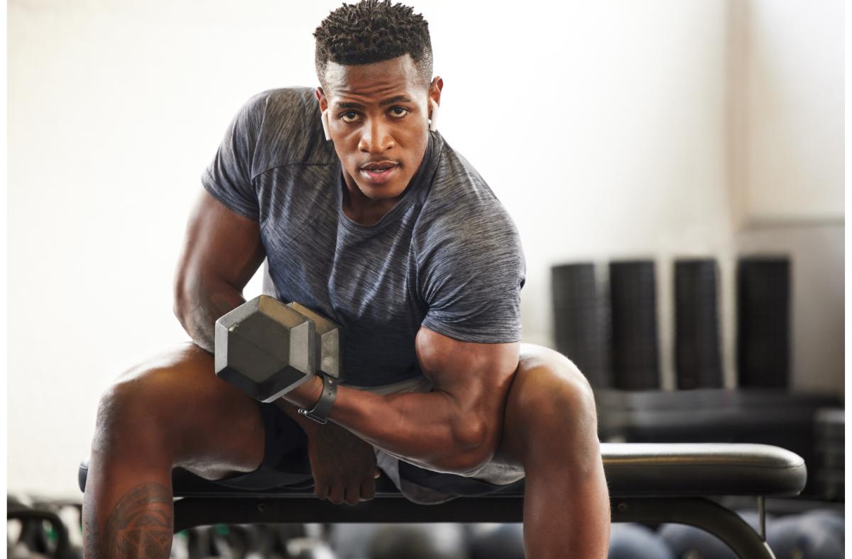 man-weight-lifting-seated-dumbbell-curl